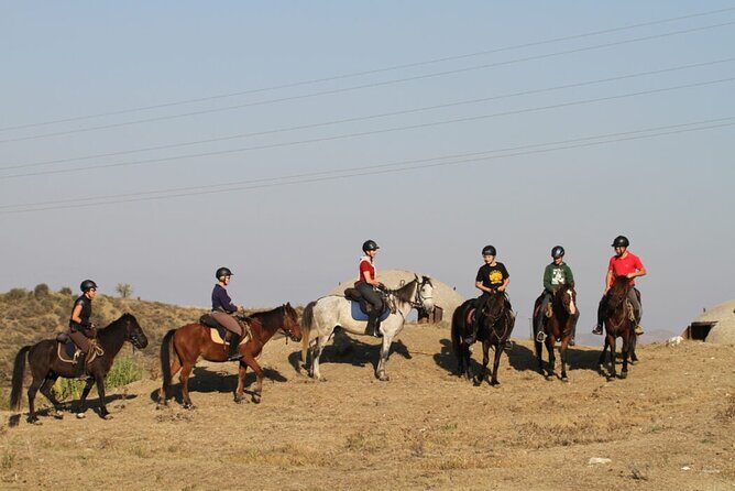 2-Hours Guided Drino's Valley Ride - Cini Lake photo stop: the 15-hectare view with horses and herds